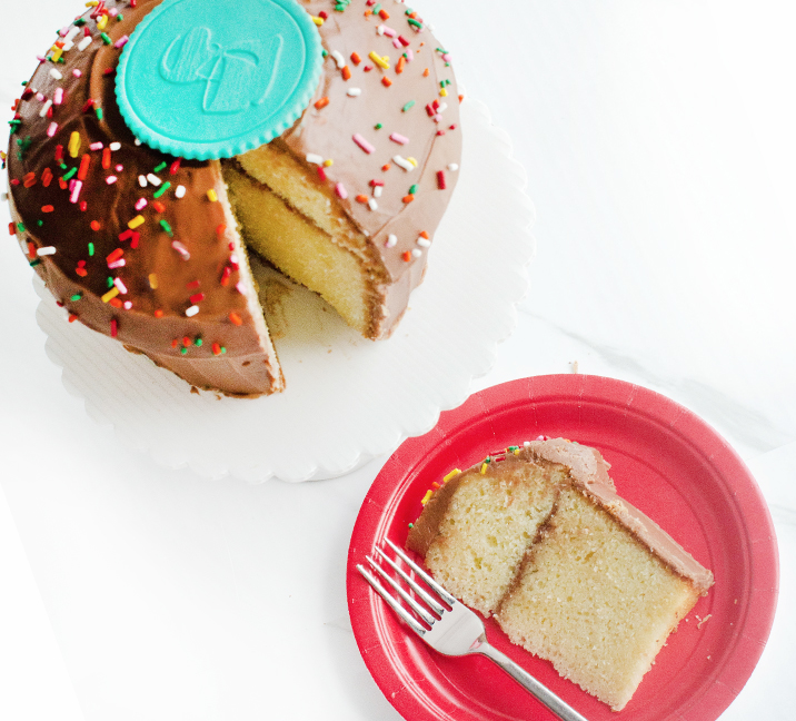 We bake our cupcakes fresh daily. (Shown: Giant Old Fashioned Birthday Cake cupcakes.)