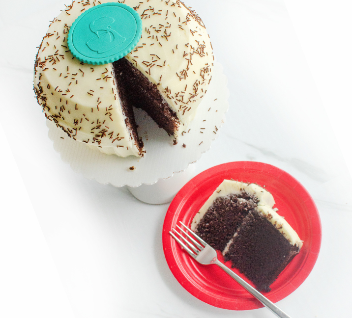 We bake our cupcakes fresh daily. (Shown: Giant Vanilla on Chocolate cupcakes.)