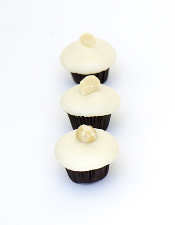 We bake our cupcakes fresh daily. (Shown: White Chocolate Macadamia Nut cupcakes.)